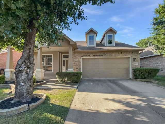 6400 Hawthorn Dr, Denton, TX 76208 - view of front of property featuring an attached garage, driveway, and brick siding