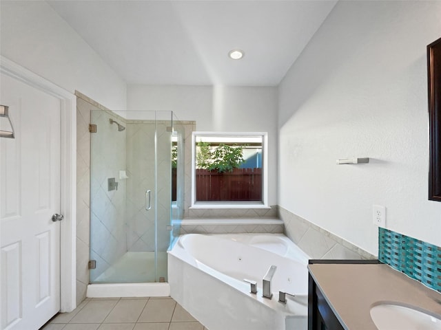 6400 Hawthorn Dr, Denton, TX 76208 - full bathroom featuring tile patterned floors, a jetted tub, a shower stall, and vanity