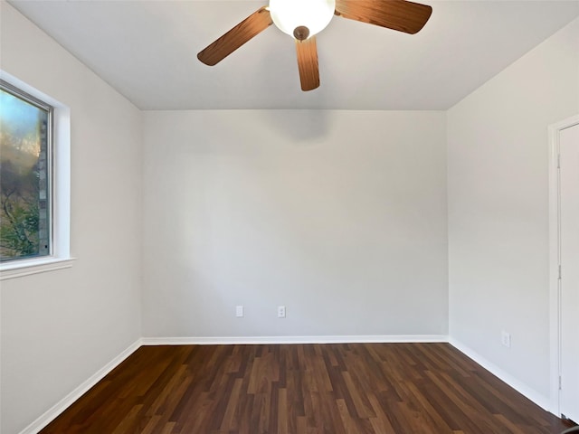 6400 Hawthorn Dr, Denton, TX 76208 - unfurnished room featuring dark wood-style flooring, ceiling fan, and baseboards
