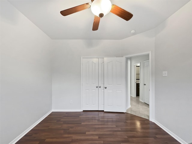 6400 Hawthorn Dr, Denton, TX 76208 - unfurnished bedroom with wood finished floors, baseboards, a closet, and a ceiling fan