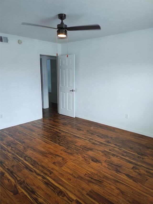 7121 Harwick Ln, North Richland Hills, TX 76182 - spare room featuring a ceiling fan, dark wood finished floors, and baseboards