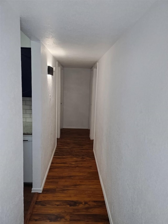 7121 Harwick Ln, North Richland Hills, TX 76182 - hallway featuring wood finished floors, baseboards, and a textured wall