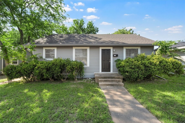 2320 Herring Ave, Waco, TX 76708 - view of front of home featuring a front lawn and a shingled roof