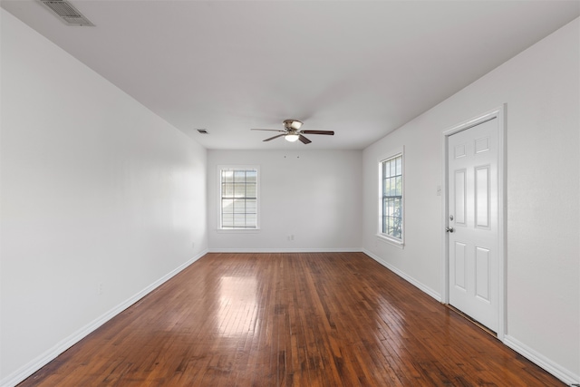 2320 Herring Ave, Waco, TX 76708 - empty room featuring plenty of natural light, a ceiling fan, baseboards, and wood-type flooring