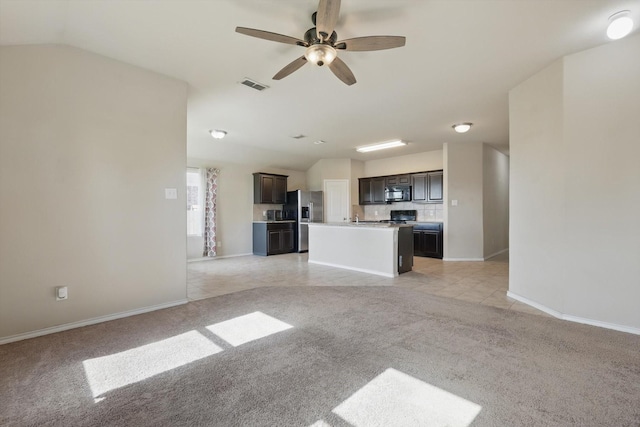 309 Pimlico Way, Ponder, TX 76259 - unfurnished living room featuring light carpet, ceiling fan, baseboards, lofted ceiling, and light tile patterned floors