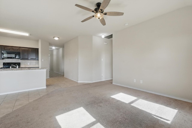 309 Pimlico Way, Ponder, TX 76259 - unfurnished living room featuring ceiling fan, baseboards, and light tile patterned floors