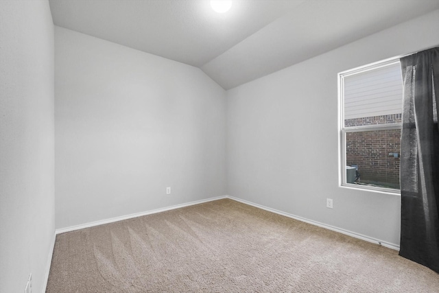 309 Pimlico Way, Ponder, TX 76259 - carpeted empty room with vaulted ceiling and baseboards
