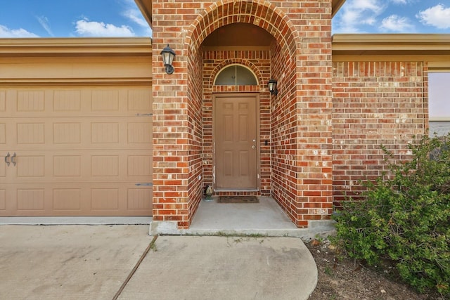 309 Pimlico Way, Ponder, TX 76259 - entrance to property with brick siding, a garage, and driveway