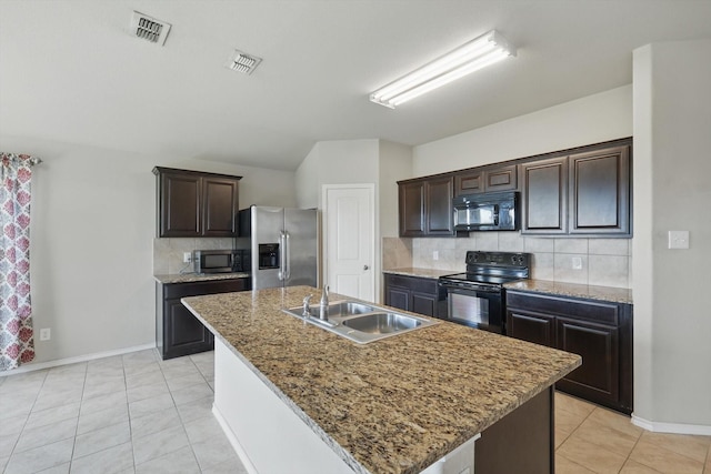 309 Pimlico Way, Ponder, TX 76259 - kitchen featuring black appliances, a sink, backsplash, light tile patterned floors, and baseboards