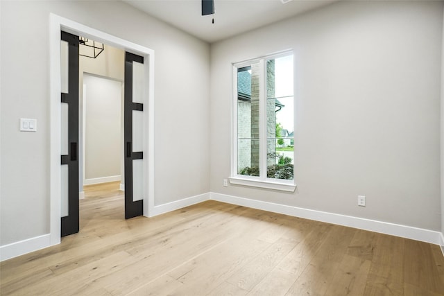 3621 Barber Crk, Fort Worth, TX 76244 - unfurnished room with healthy amount of natural light, light wood-style flooring, a ceiling fan, and baseboards