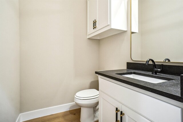 3621 Barber Crk, Fort Worth, TX 76244 - half bath with vanity, toilet, baseboards, and wood finished floors