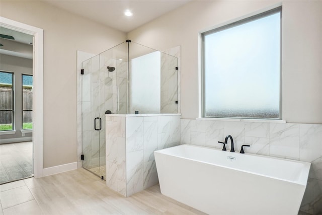 3621 Barber Crk, Fort Worth, TX 76244 - full bath with a soaking tub, a marble finish shower, tile walls, and recessed lighting