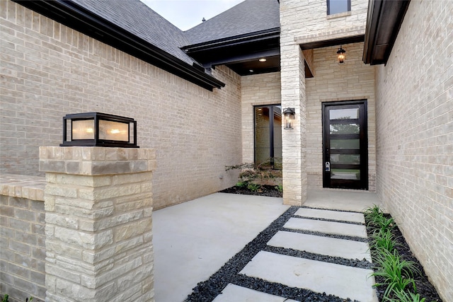 3621 Barber Crk, Fort Worth, TX 76244 - doorway to property featuring roof with shingles and brick siding