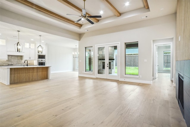 3621 Barber Crk, Fort Worth, TX 76244 - unfurnished living room featuring beamed ceiling, a fireplace, light wood finished floors, ceiling fan, and a sink