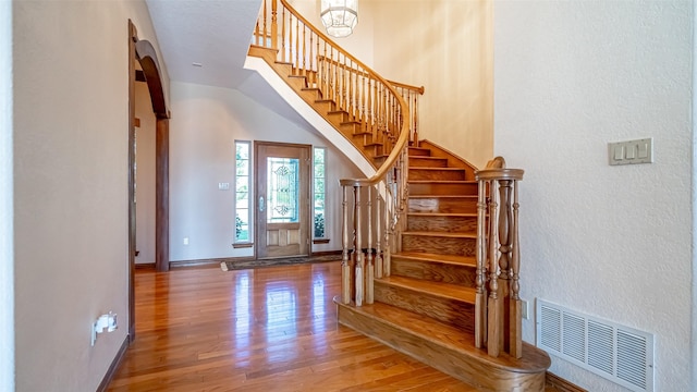 1905 Yucatan Dr, Granbury, TX 76048 - staircase featuring wood finished floors, a textured wall, and baseboards