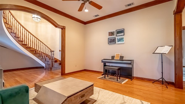 1905 Yucatan Dr, Granbury, TX 76048 - living area featuring wood finished floors, stairway, a ceiling fan, crown molding, and baseboards