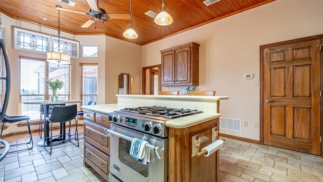 1905 Yucatan Dr, Granbury, TX 76048 - kitchen featuring high end stainless steel range, wood ceiling, light countertops, stone tile flooring, and ceiling fan