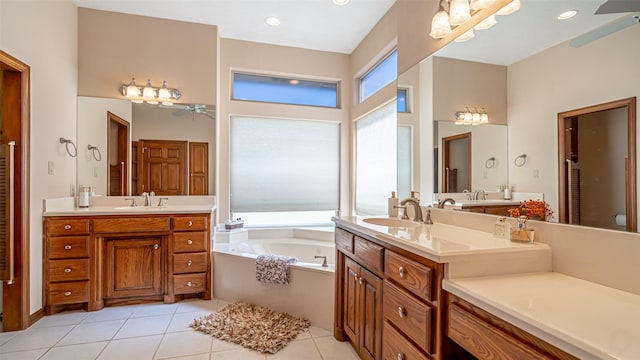 1905 Yucatan Dr, Granbury, TX 76048 - bathroom featuring a towering ceiling, a ceiling fan, tile patterned flooring, a bath, and two vanities