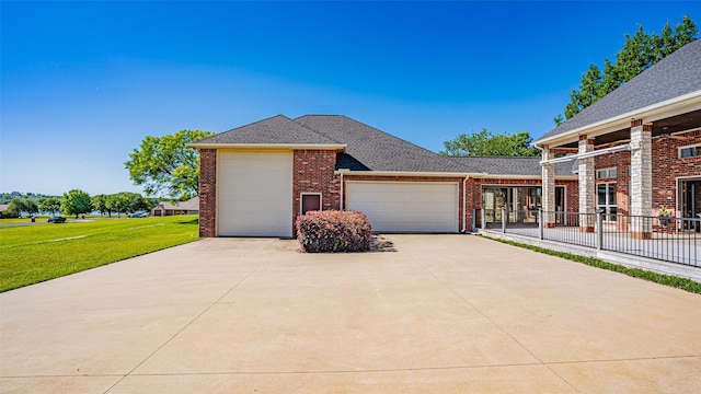 1905 Yucatan Dr, Granbury, TX 76048 - view of front facade with brick siding, a garage, concrete driveway, and roof with shingles