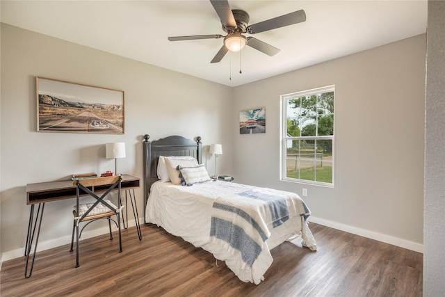 bedroom with wood finished floors, baseboards, and a ceiling fan