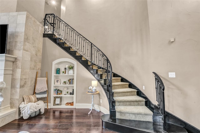 124 Oakvista Dr, Aledo, TX 76008 - staircase with a high ceiling, built in shelves, wood finished floors, and baseboards