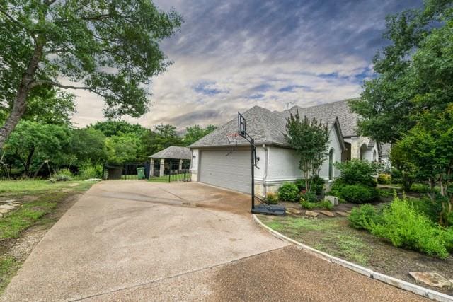 124 Oakvista Dr, Aledo, TX 76008 - view of side of home featuring driveway and an attached garage