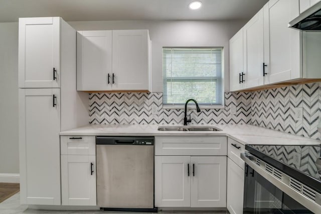 kitchen featuring dishwasher, a sink, ventilation hood, light countertops, and white cabinets