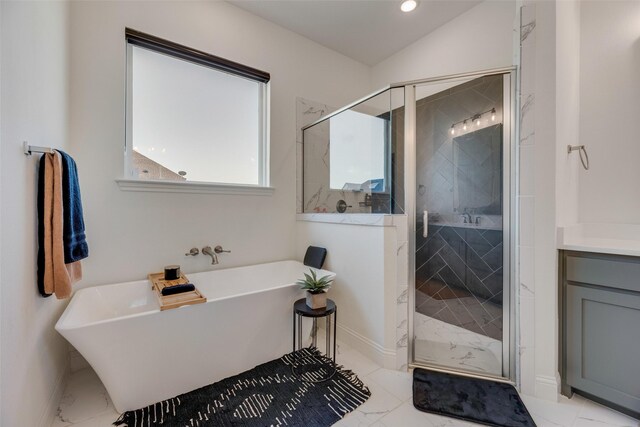 467 Red Bird Dr, Springtown, TX 76082 - full bath with marble look tile flooring, a shower stall, a freestanding bath, baseboards, and recessed lighting