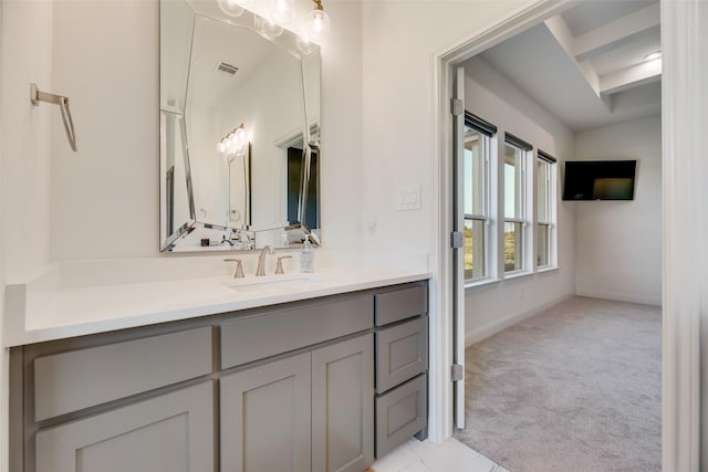 467 Red Bird Dr, Springtown, TX 76082 - bathroom featuring vanity, baseboards, and beamed ceiling
