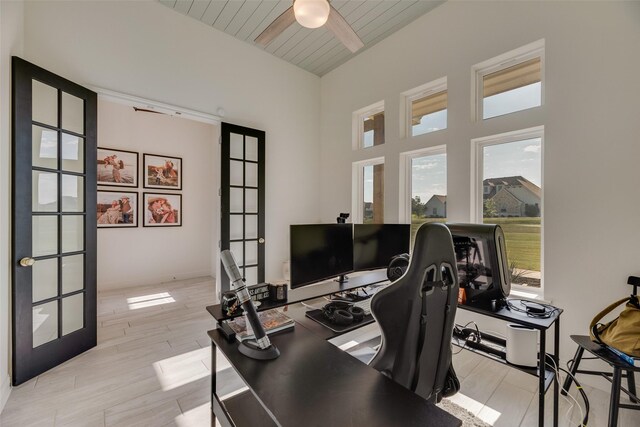 467 Red Bird Dr, Springtown, TX 76082 - office area with ceiling fan, wooden ceiling, french doors, beam ceiling, and light wood-style flooring
