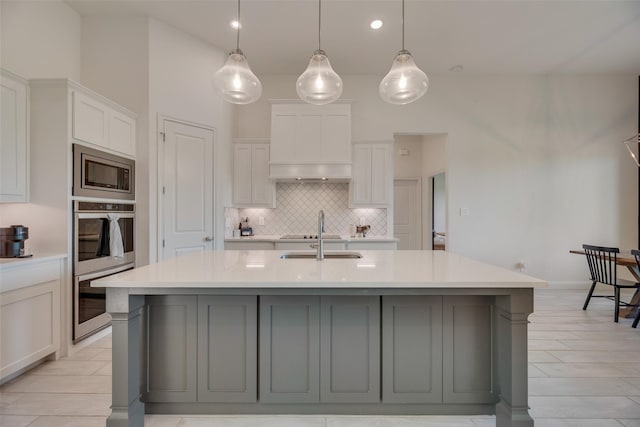 467 Red Bird Dr, Springtown, TX 76082 - kitchen featuring a sink, appliances with stainless steel finishes, light countertops, tasteful backsplash, and white cabinets