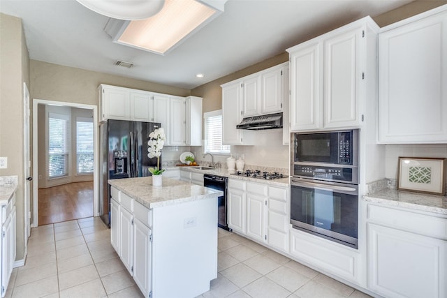 4136 Timberglen Rd, Dallas, TX 75287 - kitchen featuring black appliances, a sink, a center island, backsplash, and white cabinetry
