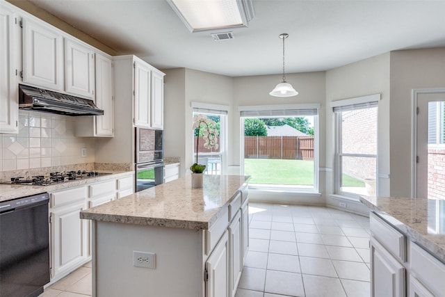 4136 Timberglen Rd, Dallas, TX 75287 - kitchen with gas stovetop, dishwasher, under cabinet range hood, oven, and decorative backsplash