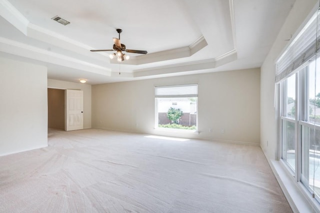 4136 Timberglen Rd, Dallas, TX 75287 - unfurnished room featuring a tray ceiling, light carpet, a ceiling fan, baseboards, and crown molding