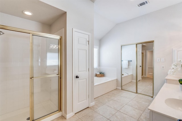 4136 Timberglen Rd, Dallas, TX 75287 - full bath with a garden tub, a stall shower, tile patterned floors, lofted ceiling, and double vanity