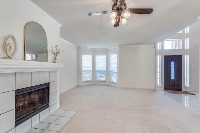 4136 Timberglen Rd, Dallas, TX 75287 - unfurnished living room featuring crown molding, carpet floors, a tiled fireplace, a ceiling fan, and baseboards