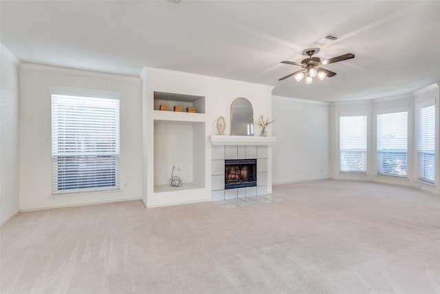 4136 Timberglen Rd, Dallas, TX 75287 - unfurnished living room featuring crown molding, carpet floors, ceiling fan, a fireplace, and plenty of natural light