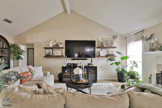 5249 Western Plains Ave, Abilene, TX 79606 - living room featuring wood finished floors, beam ceiling, baseboards, and high vaulted ceiling