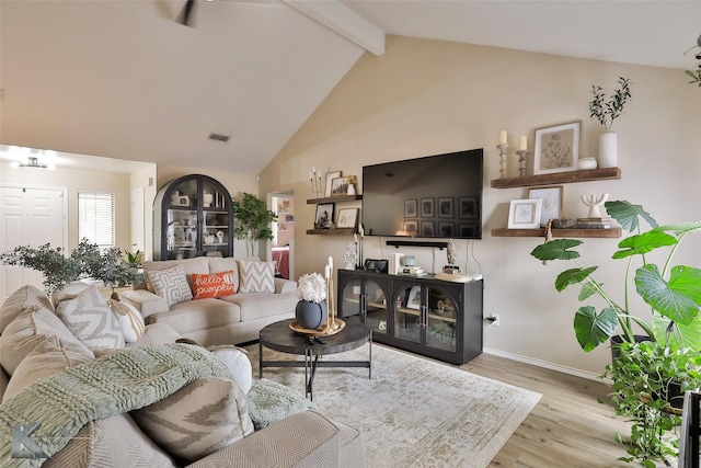 5249 Western Plains Ave, Abilene, TX 79606 - living room with beam ceiling, wood finished floors, high vaulted ceiling, and baseboards