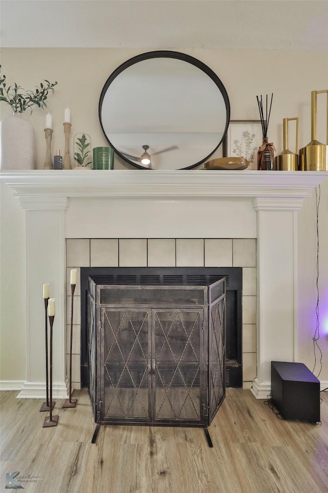 5249 Western Plains Ave, Abilene, TX 79606 - detailed view of a fireplace, wood finished floors, baseboards, and ceiling fan