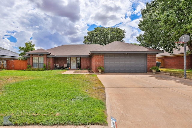 5249 Western Plains Ave, Abilene, TX 79606 - ranch-style house featuring a garage, driveway, and brick siding
