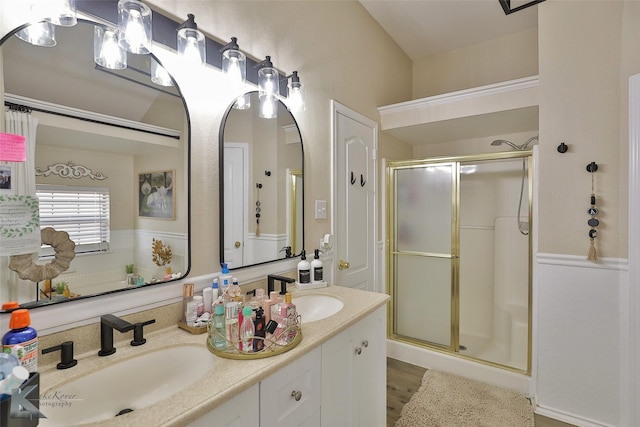 5249 Western Plains Ave, Abilene, TX 79606 - full bath featuring a stall shower, double vanity, and wood finished floors