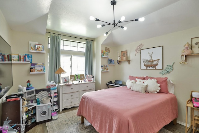 5249 Western Plains Ave, Abilene, TX 79606 - bedroom with a chandelier and wood finished floors