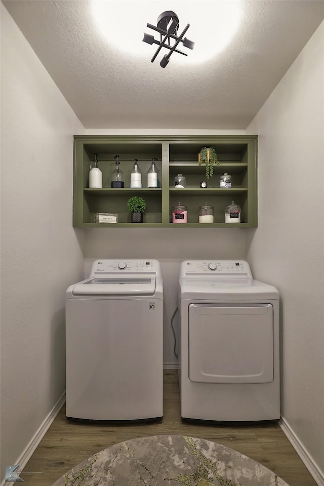 5249 Western Plains Ave, Abilene, TX 79606 - clothes washing area with independent washer and dryer, baseboards, and wood finished floors