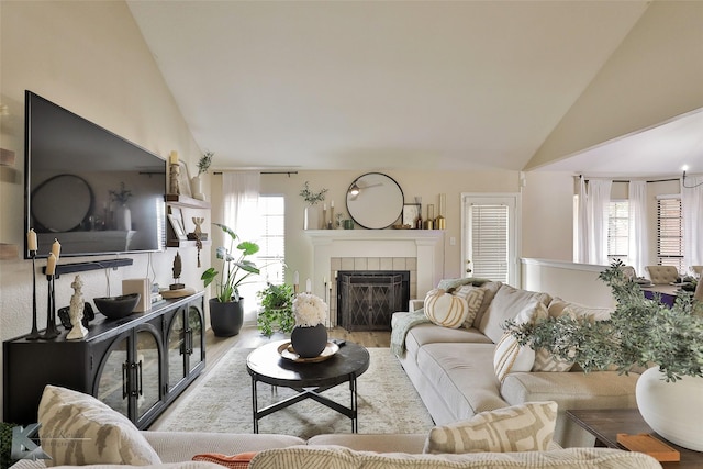5249 Western Plains Ave, Abilene, TX 79606 - living area with a tile fireplace, wood finished floors, and high vaulted ceiling