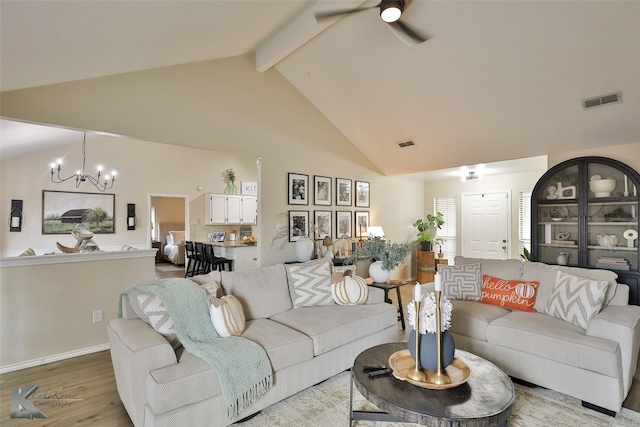 5249 Western Plains Ave, Abilene, TX 79606 - living area with a chandelier, light wood-style floors, a ceiling fan, high vaulted ceiling, and beamed ceiling