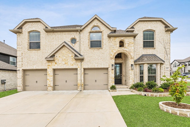 639 Cirrus Ln, Fate, TX 75087 - french country inspired facade featuring a garage, driveway, a front yard, and a shingled roof