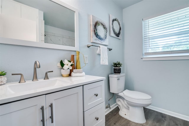 2335 San Paula Ave, Dallas, TX 75228 - full bathroom with vanity, toilet, wood finished floors, and baseboards