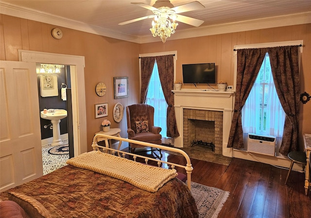 301 W Larissa St, Jacksonville, TX 75766 - bedroom featuring ornamental molding, wood-type flooring, a brick fireplace, ceiling fan, and cooling unit