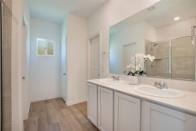 2560 Eden Creek Dr, Fort Worth, TX 76179 - bathroom featuring a stall shower, wood finished floors, and double vanity